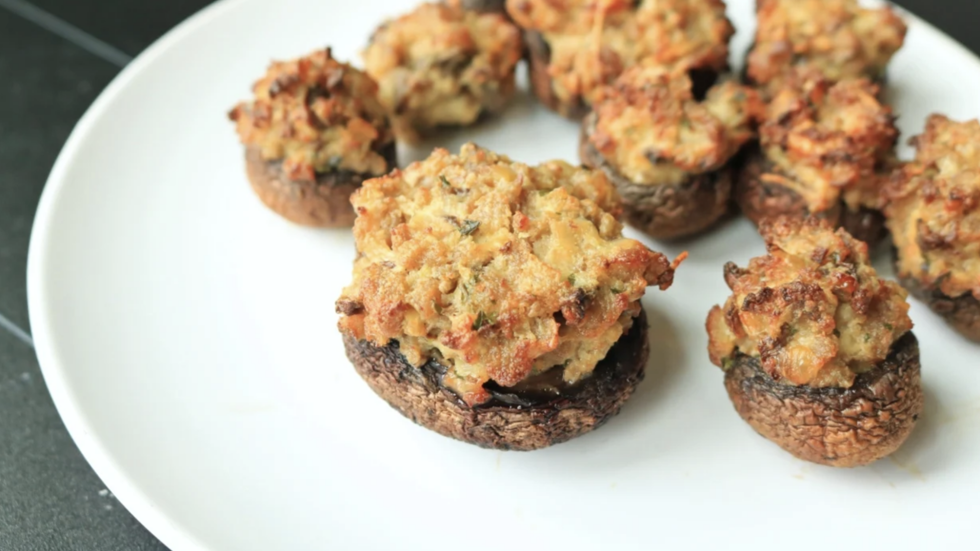 A plate full of stuffed mushrooms.